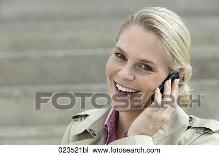 portrait of young businesswoman talking on mobile phone View Large Photo Image Stock Image - portrait of young businesswoman talking on mobile phone. Fotosearch
