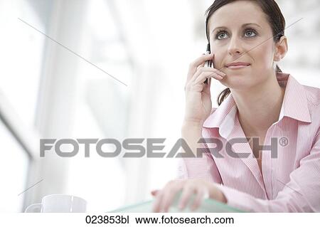 portrait of young businesswoman talking on mobile phone View Large Photo Image Stock Image - portrait of young businesswoman talking on mobile phone. Fotosearch