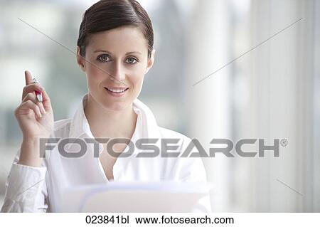 Stock Image - portrait of young businesswoman with document. Fotosearch
