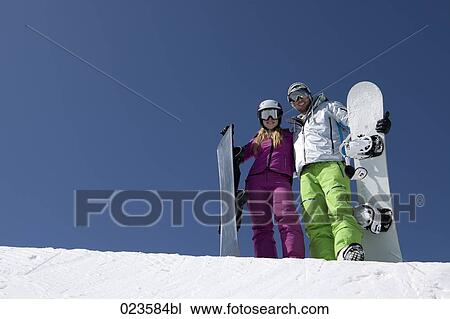 portrait of young couple with snowboards View Large Photo Image Stock Image - portrait of young couple with snowboards. Fotosearch