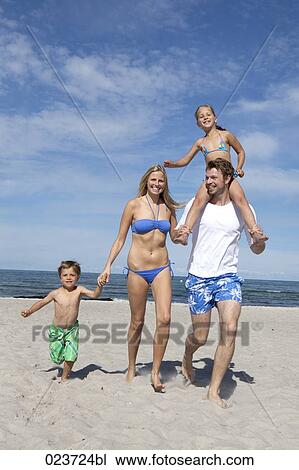 portrait of young family on the beach View Large Photo Image Stock Image - portrait of young family on the beach. Fotosearch