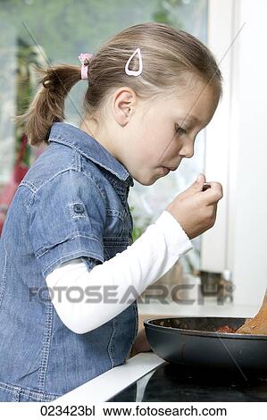 portrait of young girl cooking in kitchen View Large Photo Image Stock Image - portrait of young girl cooking in kitchen. Fotosearch
