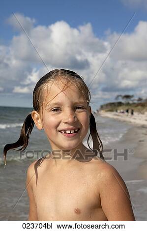 Portrait of young girl on beach Stock Image | 023704bl | Fotosearch