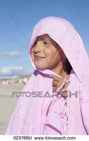 Stock Image - portrait of young girl on beach. Fotosearch