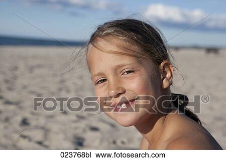 portrait of young girl on beach View Large Photo Image Stock Image - portrait of young girl on beach. Fotosearch