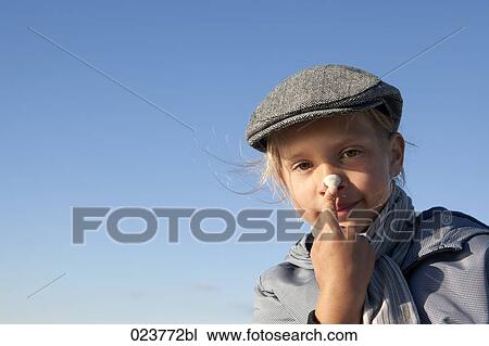 portrait of young girl putting lotion on her nose View Large Photo Image Stock Image - portrait of young girl putting lotion on her nose. Fotosearch