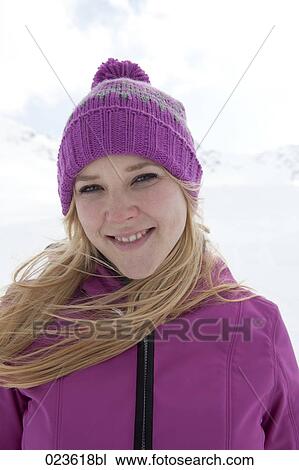 Stock Image - portrait of young woman in the mountains. Fotosearch