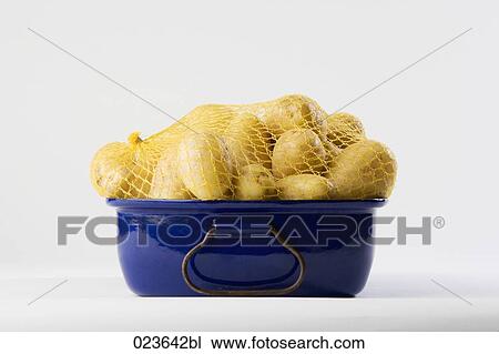 potatoes in blue pot View Large Photo Image Stock Image - potatoes in blue pot. Fotosearch