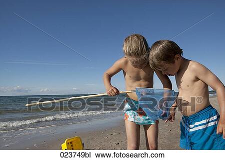sister and brother looking at catch in spoon net View Large Photo Image Stock Image - sister and brother looking at catch in spoon net. Fotosearch