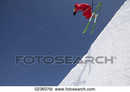 skier racing down the mountains View Large Photo Image Stock Image - skier racing down the mountains. Fotosearch