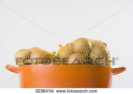 still life of onions in orange pot View Large Photo Image Stock Image - still life of onions in orange pot. Fotosearch