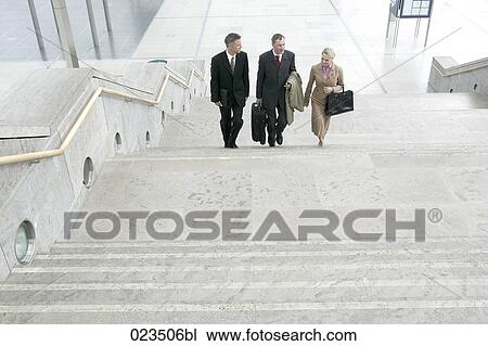 three business people walking up stairway View Large Photo Image Stock Image - three business people walking up stairway. Fotosearch
