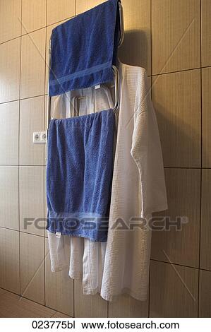 Stock Image - towels and bathrobe in hotel. Fotosearch
