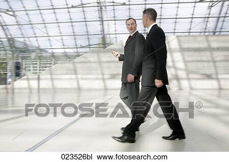 two businessmen talking to each other View Large Photo Image Stock Image - two businessmen talking to each other. Fotosearch