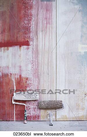 two paint rollers leaning against wall View Large Photo Image Stock Image - two paint rollers leaning against wall. Fotosearch