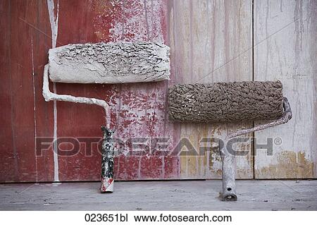 two paint rollers leaning against wall View Large Photo Image Stock Image - two paint rollers leaning against wall. Fotosearch