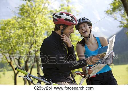 young cyclists studying map View Large Photo Image Stock Image - young cyclists studying map. Fotosearch
