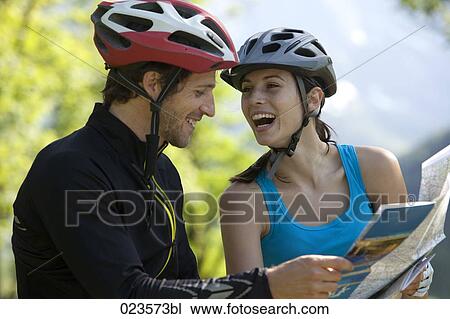 young cyclists studying map View Large Photo Image Stock Image - young cyclists studying map. Fotosearch