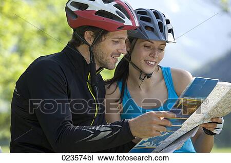 young cyclists studying map View Large Photo Image Stock Image - young cyclists studying map. Fotosearch