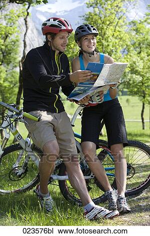 young cyclists studying map View Large Photo Image Stock Image - young cyclists studying map. Fotosearch