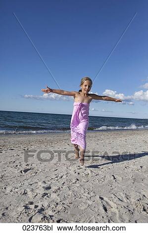 young girl having fun on beach View Large Photo Image Stock Image - young girl having fun on beach. Fotosearch