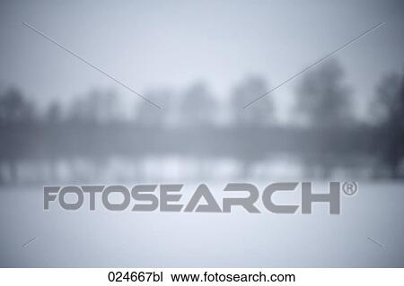 Stock Image - blurred winter landscape. Fotosearch