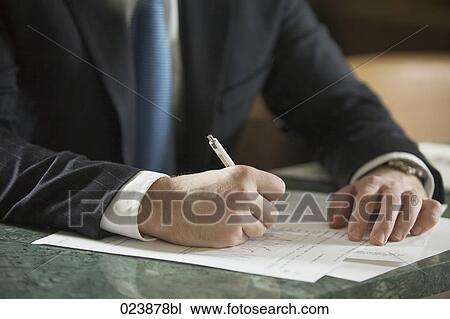close-up of businessman writing document View Large Photo Image Stock Image - close-up of businessman writing document. Fotosearch