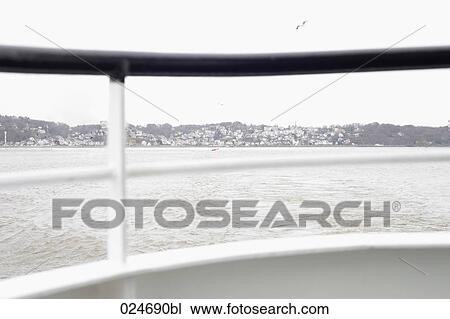 coastal town seen through railing of ship View Large Photo Image Stock Image - coastal town seen through railing of ship. Fotosearch