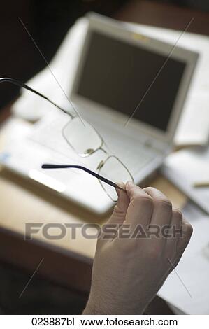 detail of businessman holding his glasses View Large Photo Image Stock Image - detail of businessman holding his glasses. Fotosearch