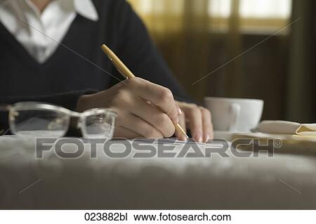 detail of businesswoman signing document during business lunch View Large Photo Image Stock Image - detail of businesswoman signing document during business lunch. Fotosearch