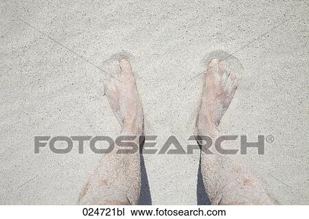 detail of woman standing on sandy beach View Large Photo Image Stock Image - detail of woman standing on sandy beach. Fotosearch
