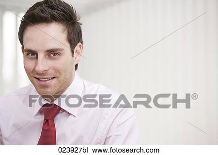 Stock Image - headshot of young businessman. Fotosearch
