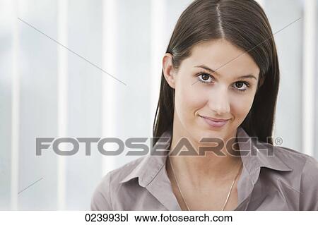 Stock Image - headshot of young businesswoman. Fotosearch