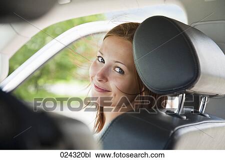 headshot of young woman sitting in car View Large Photo Image Stock Image - headshot of young woman sitting in car. Fotosearch
