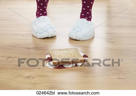 Stock Image - jam sandwich fallen on the floor. Fotosearch