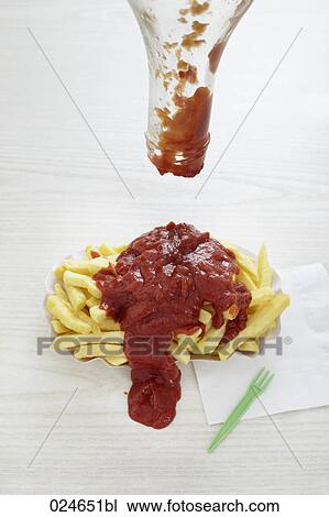 ketchup spilled over portion of chips View Large Photo Image Stock Image - ketchup spilled over portion of chips. Fotosearch