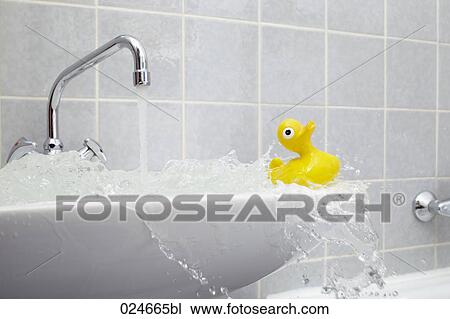Overflowing Sink In Bathroom With Yellow Rubber Duck Stock Image