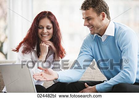 portrait od young couple at home in front of laptop computer View Large Photo Image Stock Image - portrait od young couple at home in front of laptop computer. Fotosearch
