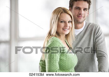 Stock Image - portrait of businesswoman and male colleague. Fotosearch