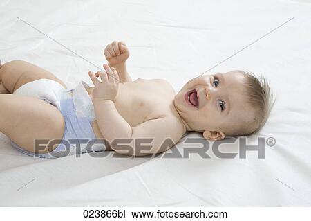 Stock Image - portrait of laughing baby boy. Fotosearch