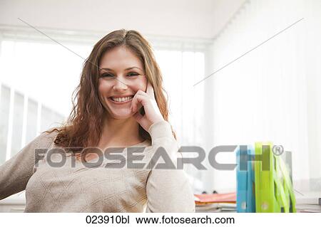 Stock Image - portrait of smiling young businesswoman. Fotosearch