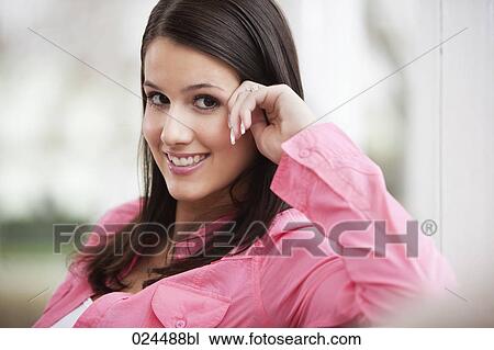 Stock Image - portrait of smiling young woman. Fotosearch