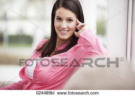 Stock Image - portrait of smiling young woman. Fotosearch