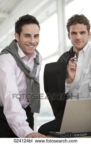 Stock Image - portrait of two young businessmen. Fotosearch