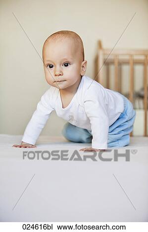 portrait of young baby boy crouching on floor View Large Photo Image Stock Image - portrait of young baby boy crouching on floor. Fotosearch
