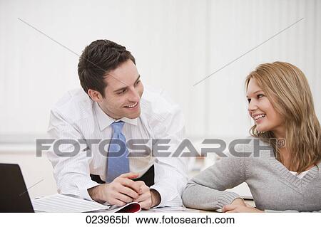 Stock Image - portrait of young businessman and female colleague. Fotosearch