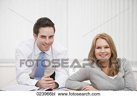 portrait of young businessman and female colleague View Large Photo Image Stock Image - portrait of young businessman and female colleague. Fotosearch