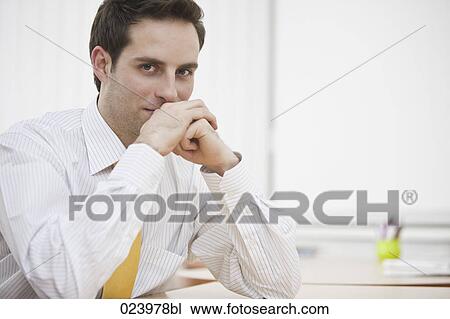 portrait of young businessman at desk View Large Photo Image Stock Image - portrait of young businessman at desk. Fotosearch