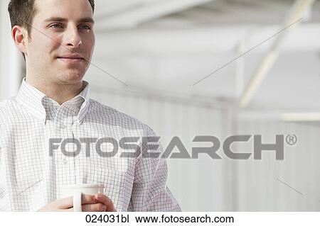 portrait of young businessman holding cup View Large Photo Image Stock Image - portrait of young businessman holding cup. Fotosearch