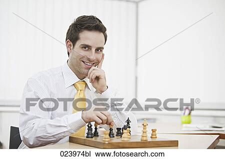 portrait of young businessman playing chess View Large Photo Image Stock Image - portrait of young businessman playing chess. Fotosearch